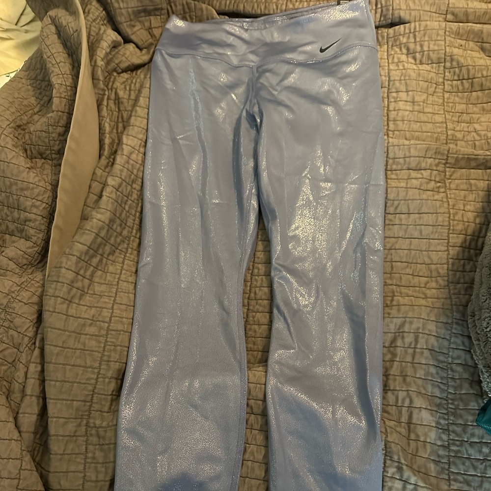 Nike training tights. Never worn tags still on. color of purple sparkles.
